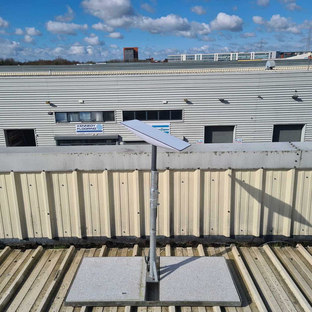 starlink antenna installed on an industrial roof