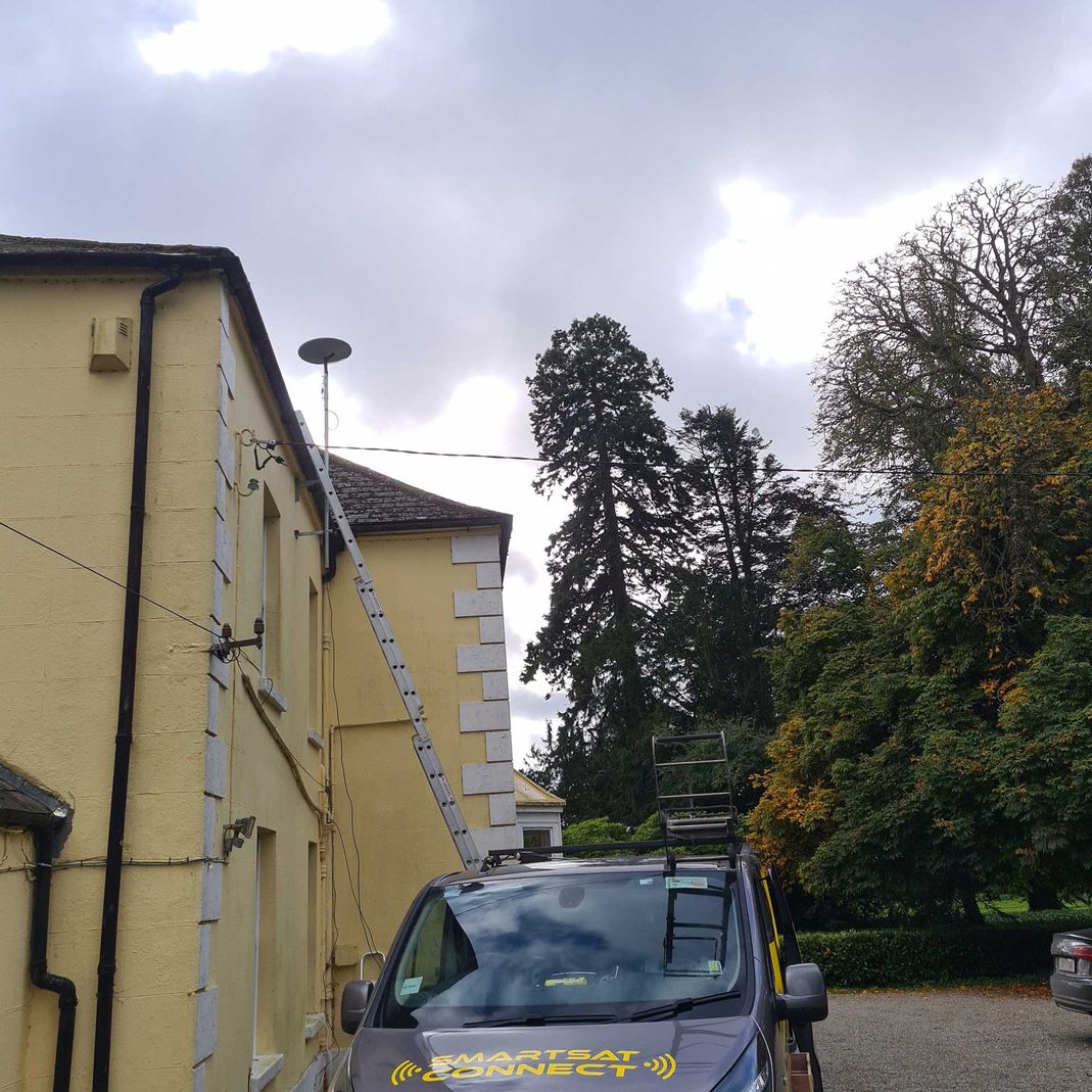 starlink antenna being installed on a residential property