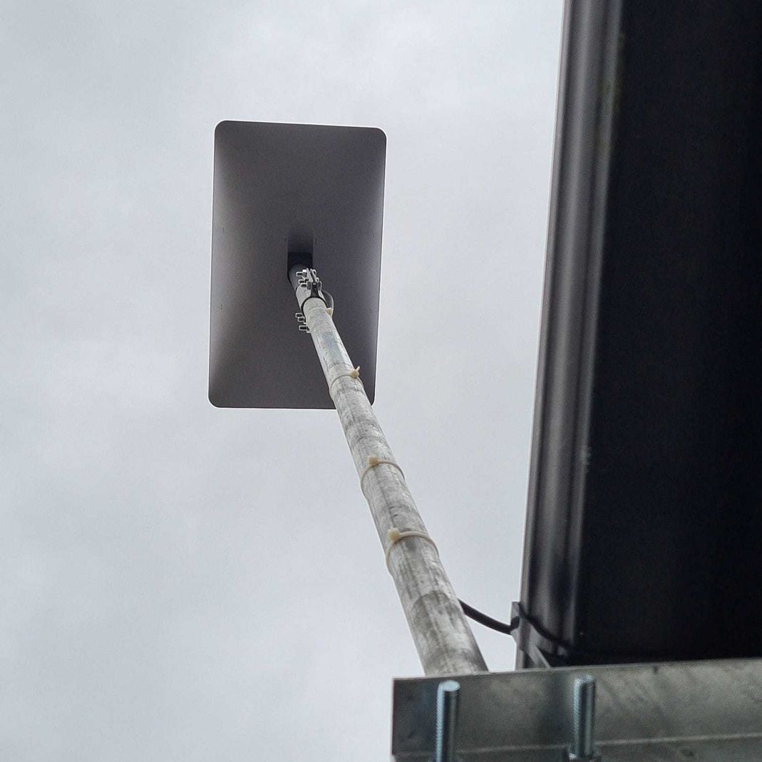 Looking up at a starlink antenna