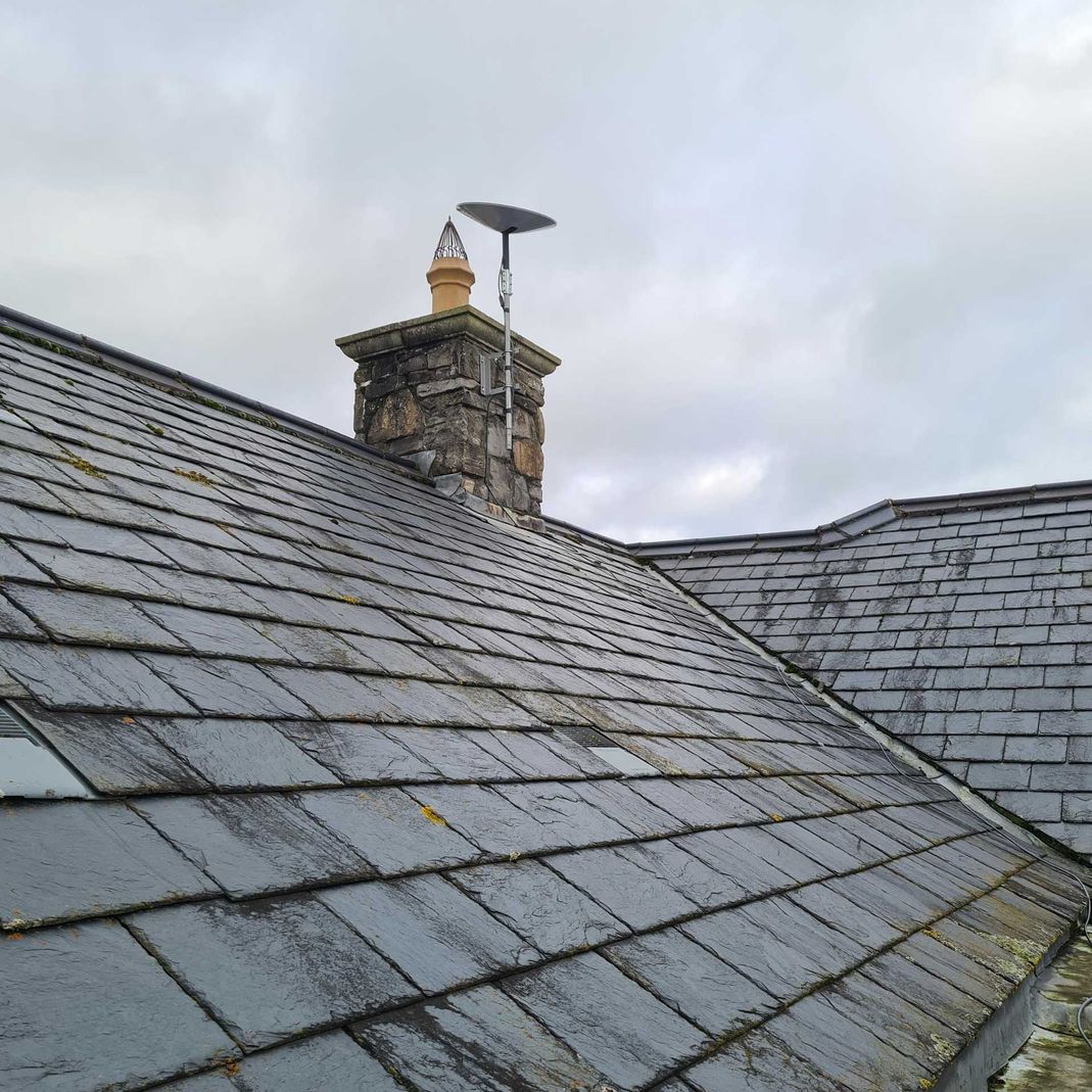 starlink antenna attached to a chimney 
